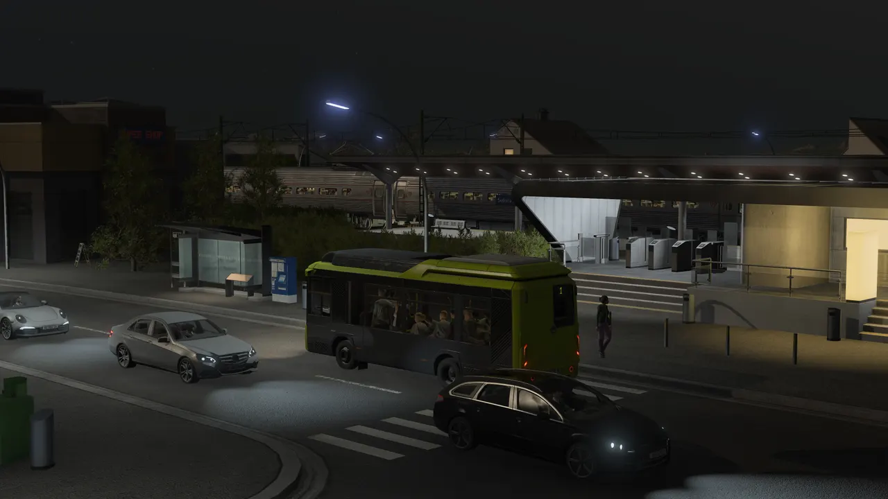 Autocarro numa estação iluminada à noite